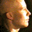 A four- shows a profile picture of a person with short light hair in profile view, displaying subtle facial expression changes