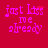 A red background displays four identical pixelated text phrases 'just kiss me already' in pink, with one instance showing a small heart animation.