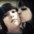 Animated sequence of two people kissing, showing slight head movement and changing light reflections on faces.