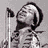 Black-and-white pixelated image featuring three figures with text repeating '60's music is the best' in multiple and