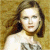 A pixelated image of a person with long brown hair against a textured beige background, next to green text reading 'Original Icons .com' on dark green.