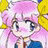 Pixelated anime-style character with pink hair and blue eyes, wearing a blue outfit with yellow accents, positioned next to black background with white text.
