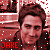 Pixelated image of a person with brown hair wearing dark clothing, overlaid with red and white dots and the name "JAKE" in block letters.
