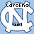 A static image of a light blue background with three white interlocking 'NC' symbols, each containing black text: 'Carolina Girl', 'Best In', and 'The World'.