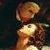 Pixelated image of a figure in golden attire holding an object, next to text reading 'The Phantom of the Opera' on white background.