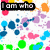 Colorful abstract pattern with scattered dots and shapes, featuring text overlays in black boxes.