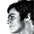 Pixelated grayscale profile of a person with dark hair, facing left, against a white background.