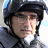 A 48x48 pixel buddy icon featuring a person wearing a helmet and glasses on the left, with text elements "NEW YORK MINUTE" in white and orange on the right against a black background.
