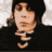 A 4-frame contact sheet of a person in various poses wearing dark clothing and a beanie, displayed as an animated buddy icon with pixelated rendering.
