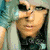 Two side-by-side pixelated images of a person with light-colored hair, one in teal tones and the other in black-and-white, each paired with text on colored backgrounds.