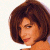 A pixelated image of a person with brown hair against a white background, next to green text on a dark green backdrop.