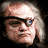 nine square showing a character with gray hair, a dark eye patch over the right eye, and a stern expression, with repeated circular eye-like symbols in surrounding