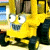 A pixelated contact sheet showing two frames of an animated yellow cartoon character with brown hair and a blue mouth, next to green text reading "Original Icons .com" on a dark background.