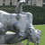 A pixelated static image shows a silver vehicle with a rounded front and visible headlights on a grassy area near a dark structure.