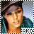 A pixelated image of a person wearing a dark cap and teal jacket with 'AKO' text below, showing subtle facial expression changes across frames.