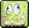 Pixelated green square icon with two large white eyes, a small brown nose, and faint mouth details on a light yellow background.