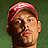 A 48x48 pixel animated contact sheet showing three sampled frames of a person wearing a red cap with white text, displayed in a 2x2 grid layout with one empty gray cell.