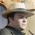 Static 50x50 pixel icon showing a man in profile wearing a wide-brimmed hat with visible facial features and clothing details against a light background.
