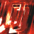 A 4-frame contact sheet of an animated icon showing a fiery red and orange text logo with glowing edges, arranged in a 2x2 grid on a dark background.
