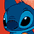 Pixelated close-up of a blue cartoon character with large black eyes and a small nose, set against an orange background.