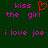 Green background with pink pixelated text reading 'kiss the girl' and 'i love joe', a red heart symbol replacing 'the' in one instance.