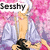 Pixelated anime-style character with white headwear and light blue robe against pink floral background, text labels change across frames.