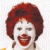 A 2x2 contact sheet of a four-frame animated clown icon with yellow background panels and blue text, showing two distinct clown expressions across frames.