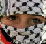 A pixelated static image shows a person's face with brown hair and light skin, partially obscured by black-and-white patterned elements.