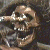 A contact sheet of two animated frames showing a pixelated skull on the left and green text reading "Original Icons .com" on the right against a dark background.