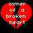 Red broken heart shape with white pixelated text "owner of a broken heart" on black background.