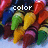 Pixelated image of colorful crayons with text overlays reading 'color', 'my', and 'world' across different sections.