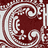 Maroon and white ornate scrollwork pattern with symmetrical floral motifs in a repeating design