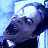 Pixelated image of a character with dark hair and blue eyes, next to 'VAN HELSING' text on a dark background.
