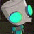 A 2x2 contact sheet of a pixelated animated icon featuring an alien character with glowing eyes and repeated text elements across four frames.