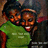 Two figures in a pixelated style, one wearing a green shirt with white text, the other in dark clothing with a light-colored headband, both with brown hair and smiling expressions.