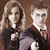 Two pixelated figures in formal attire stand side-by-side against a brown background, the left figure with long light hair and the right figure with short light hair.