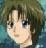 Pixelated close-up of a character with light skin, dark eyes, and brown hair against a blurred greenish-blue background.