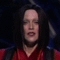 Animated sequence of a person in red and black attire performing synchronized movements with hands raised above head, then lowering to shoulders, followed by hair-flipping gestures.