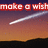 Pixelated image with red text 'make a wish' over gradient sky background featuring white streak resembling shooting star.