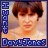 Pixelated portrait of a person with brown hair, wearing blue text elements on left and bottom edges.