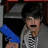Pixelated image of a person with dark hair and blue sleeve, next to text on solid blue background reading "I Love Joe Jonas <3 LOL".