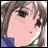 Anime-style character face with light brown hair and a blue collar, next to pixelated text on a black background.