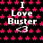 Black background with repeating pink star pattern, white text "I Love Buster" and heart symbol <3 repeated in
