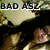 Pixelated image with text overlays showing 'BAD ASZ' and 'JESSiiEh BAYYBEE' on a black background, featuring blurred figures in camouflage patterns.