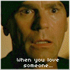 A four- animated sequence showing characters with overlaid text about love and actions, featuring pixelated faces and a hug
