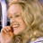 A 48x48 pixel animated contact sheet showing two frames of a blonde woman smiling and holding her hand near her face, next to green text reading "Original Icons .com" on a dark background.