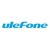 Pixelated blue text logo on white background with light blue gradient accents and subtle gray pixel details.