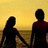 Silhouettes of two people holding hands on a beach at sunset, with red text displaying 'i love Amanda paige Bonnet' and 'forever <3 and i always wil <3'