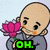 Pixelated cartoon character with bald head holds pink lotus flower, gray robe, and green text reading OH. MY. BUDDHA.