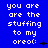 Blue background with white pixelated text reading "you are are the stuffing to my oreo:" repeated in a , with small black symbols next to some text blocks